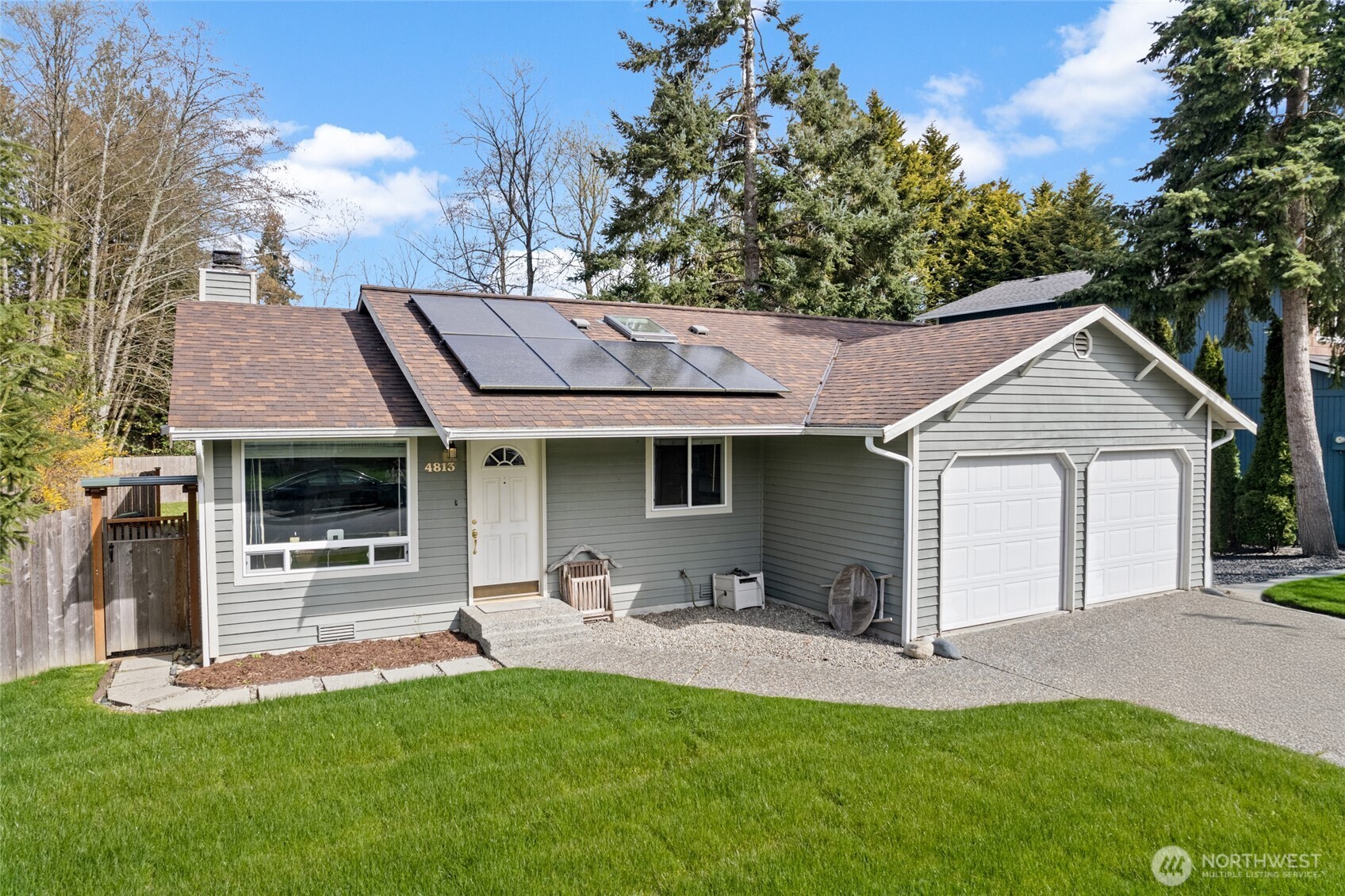 4813 150th Place Southwest Edmonds, WA 98026 - Photo 2 of 28 a front view of a house with a yard