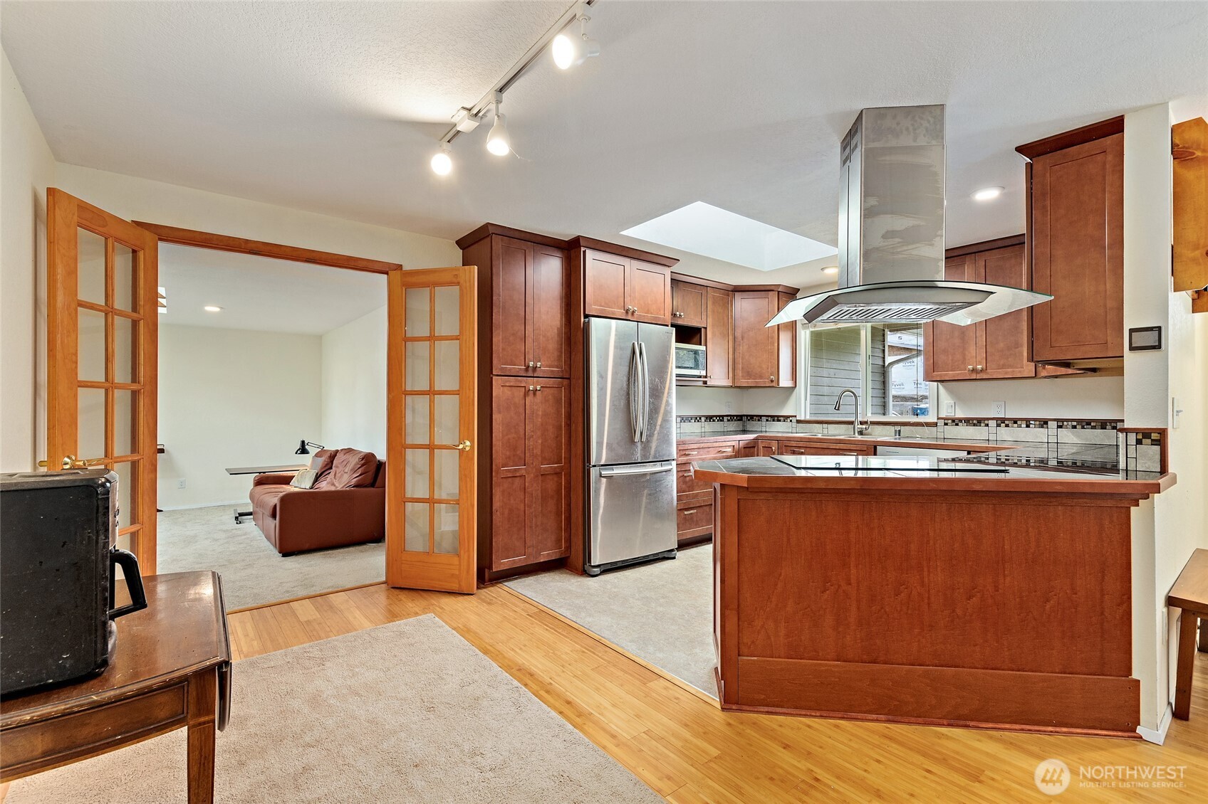 4813 150th Place Southwest Edmonds, WA 98026 - Photo 7 of 28 a large kitchen with stainless steel appliances granite countertop a stove and a refrigerator