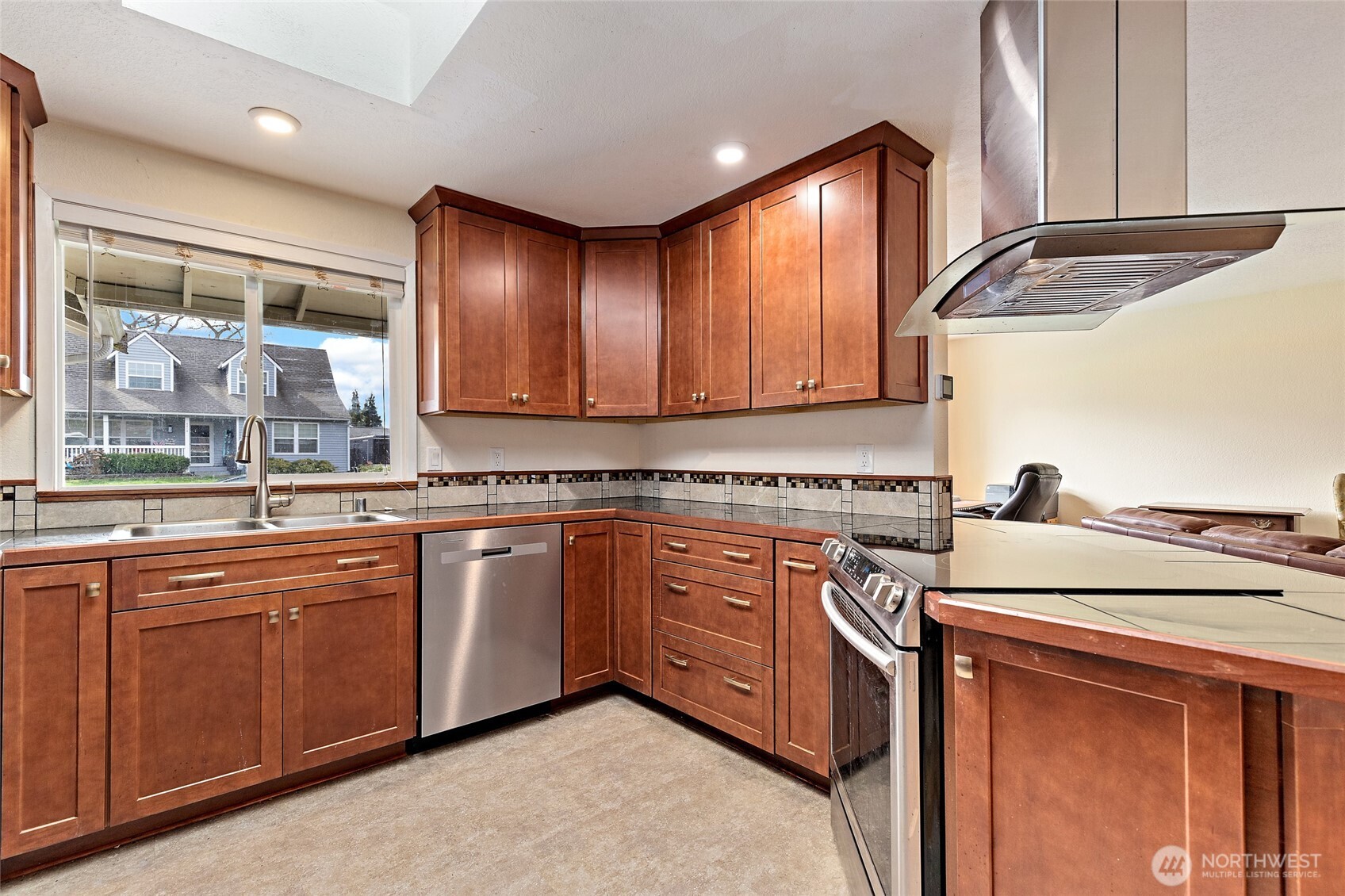4813 150th Place Southwest Edmonds, WA 98026 - Photo 10 of 28 a kitchen with stainless steel appliances granite countertop a sink stove and cabinets