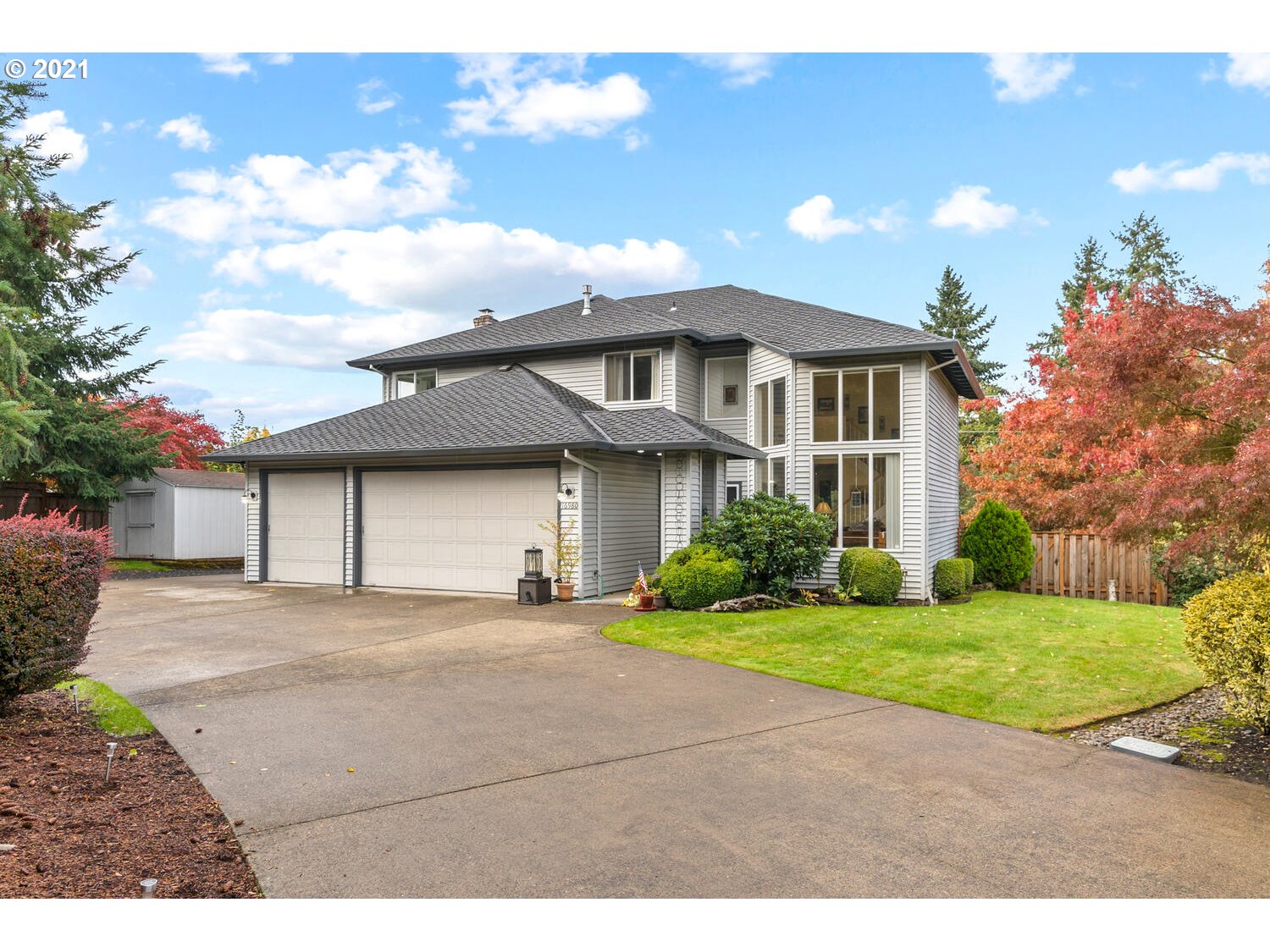 16980 Southwest Ferrelo Place Beaverton, OR 97007 - Photo 1 of 32 a front view of a house with a yard and garage