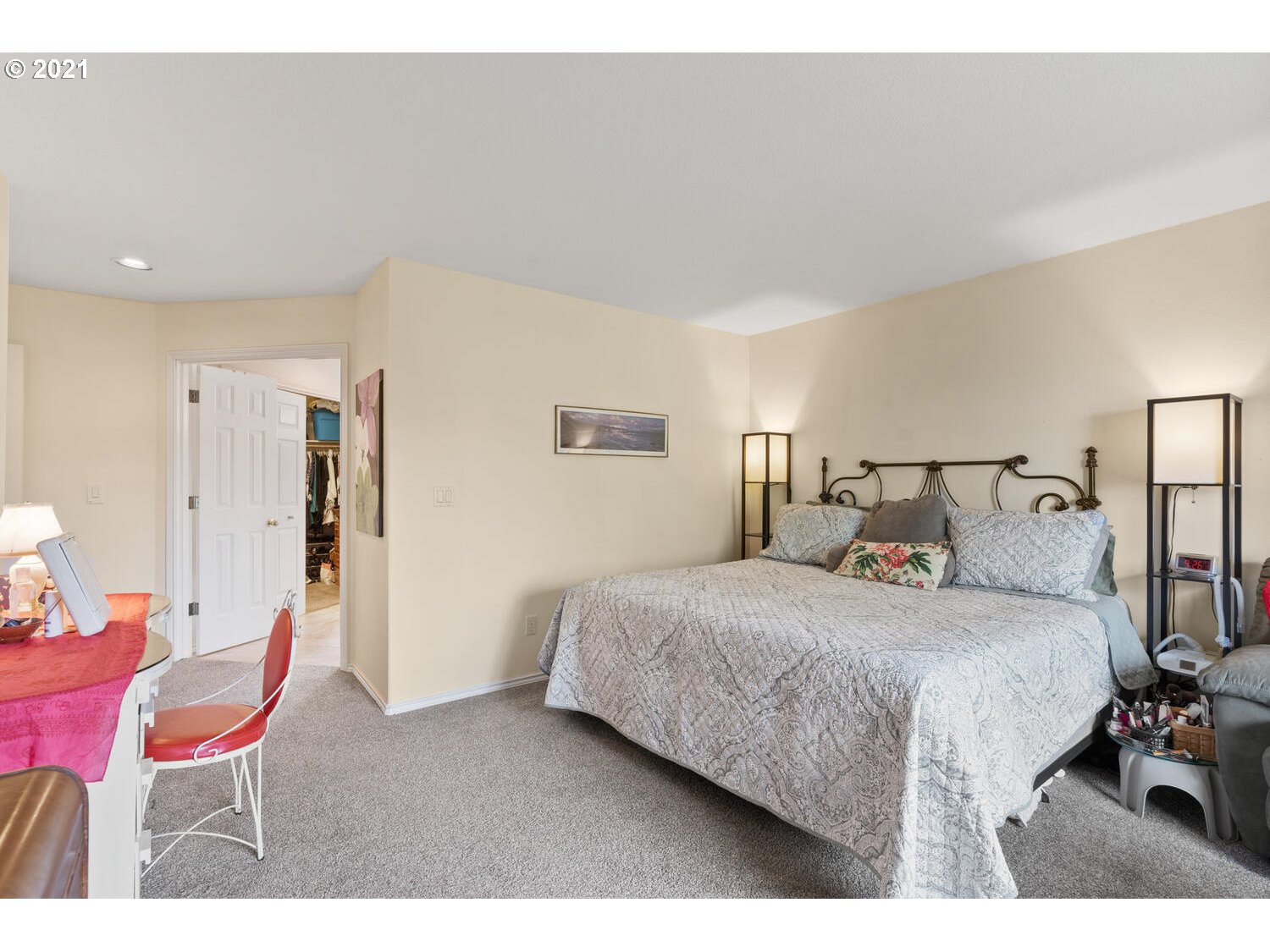 16980 Southwest Ferrelo Place Beaverton, OR 97007 - Photo 18 of 32 a bedroom with a bed a chair and potted plant