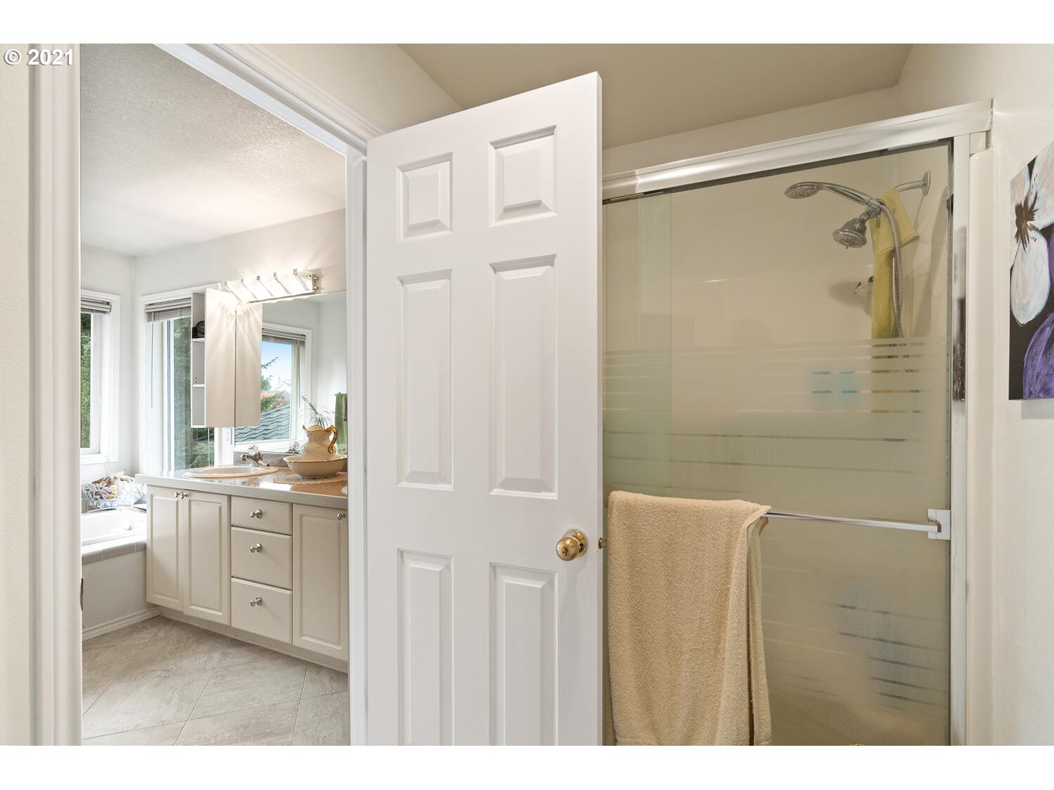 16980 Southwest Ferrelo Place Beaverton, OR 97007 - Photo 20 of 32 a bathroom with a double vanity sink mirror and shower