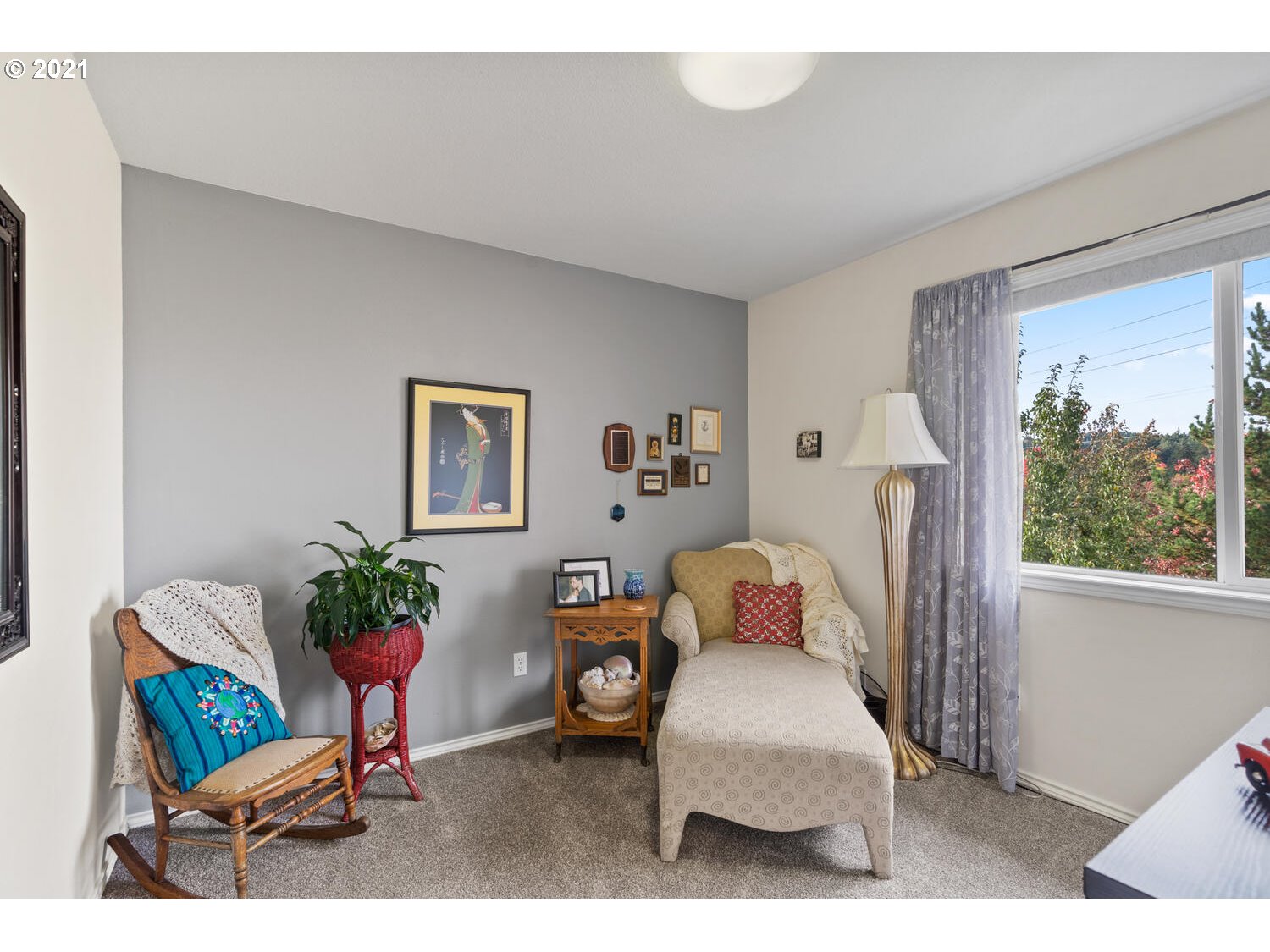 16980 Southwest Ferrelo Place Beaverton, OR 97007 - Photo 24 of 32 a living room with furniture a window and a potted plant
