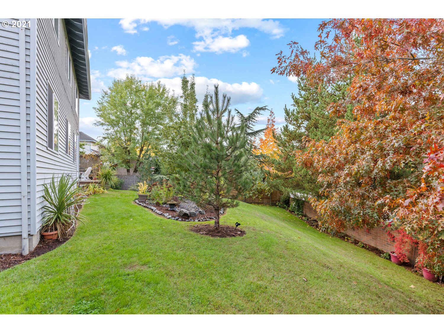 16980 Southwest Ferrelo Place Beaverton, OR 97007 - Photo 31 of 32 a green field with lots of trees