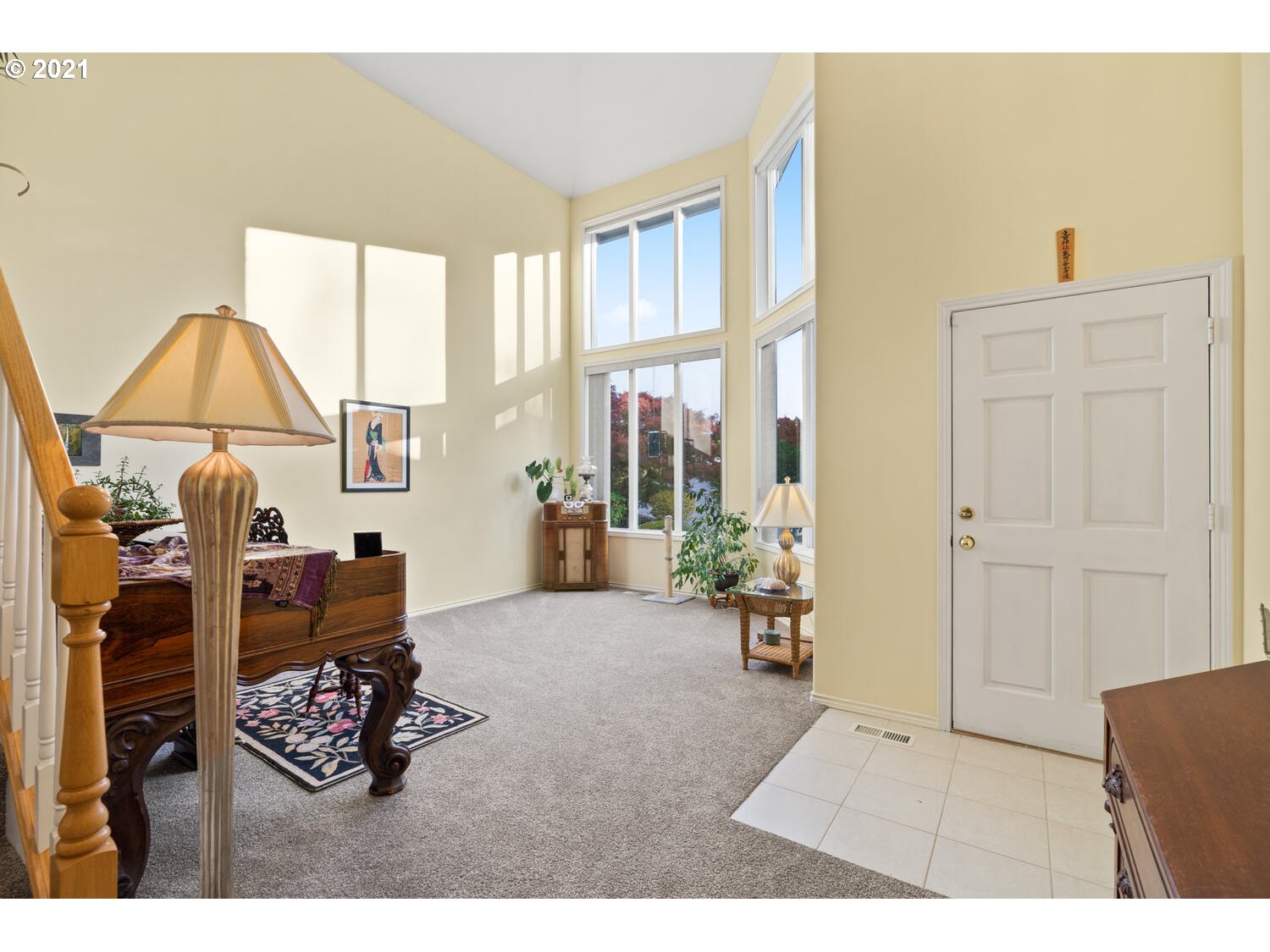 16980 Southwest Ferrelo Place Beaverton, OR 97007 - Photo 6 of 32 a living room with furniture a dining table and a large window