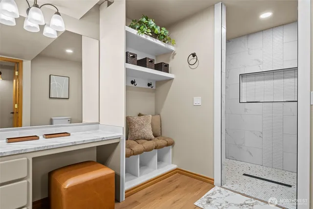 a living room with furniture and floor to ceiling windows