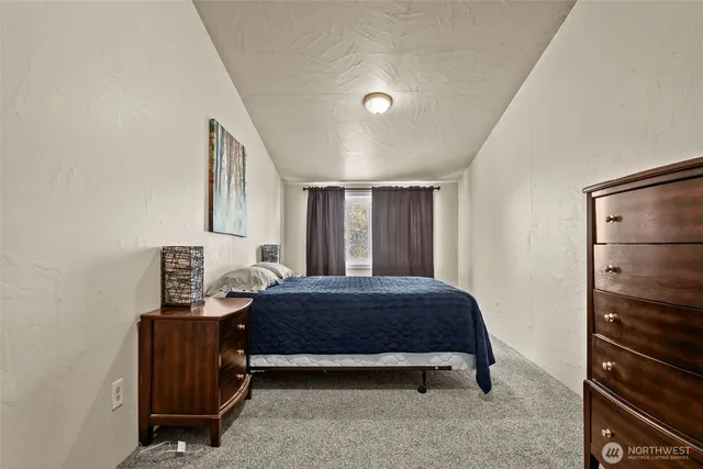 a bathroom with a sink a mirror and a shower