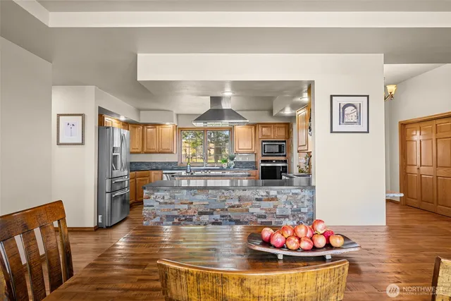 a kitchen with sink a window and cabinets