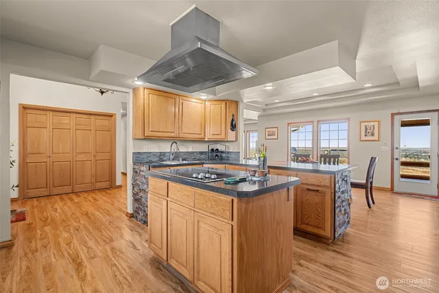 a living room with furniture a fireplace and a large window