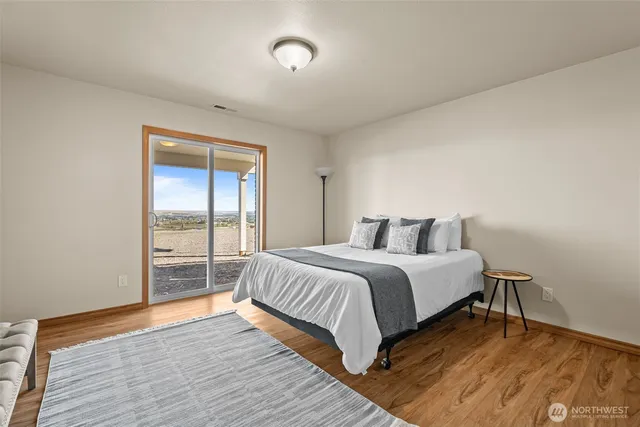 a bedroom with a bed and a chair