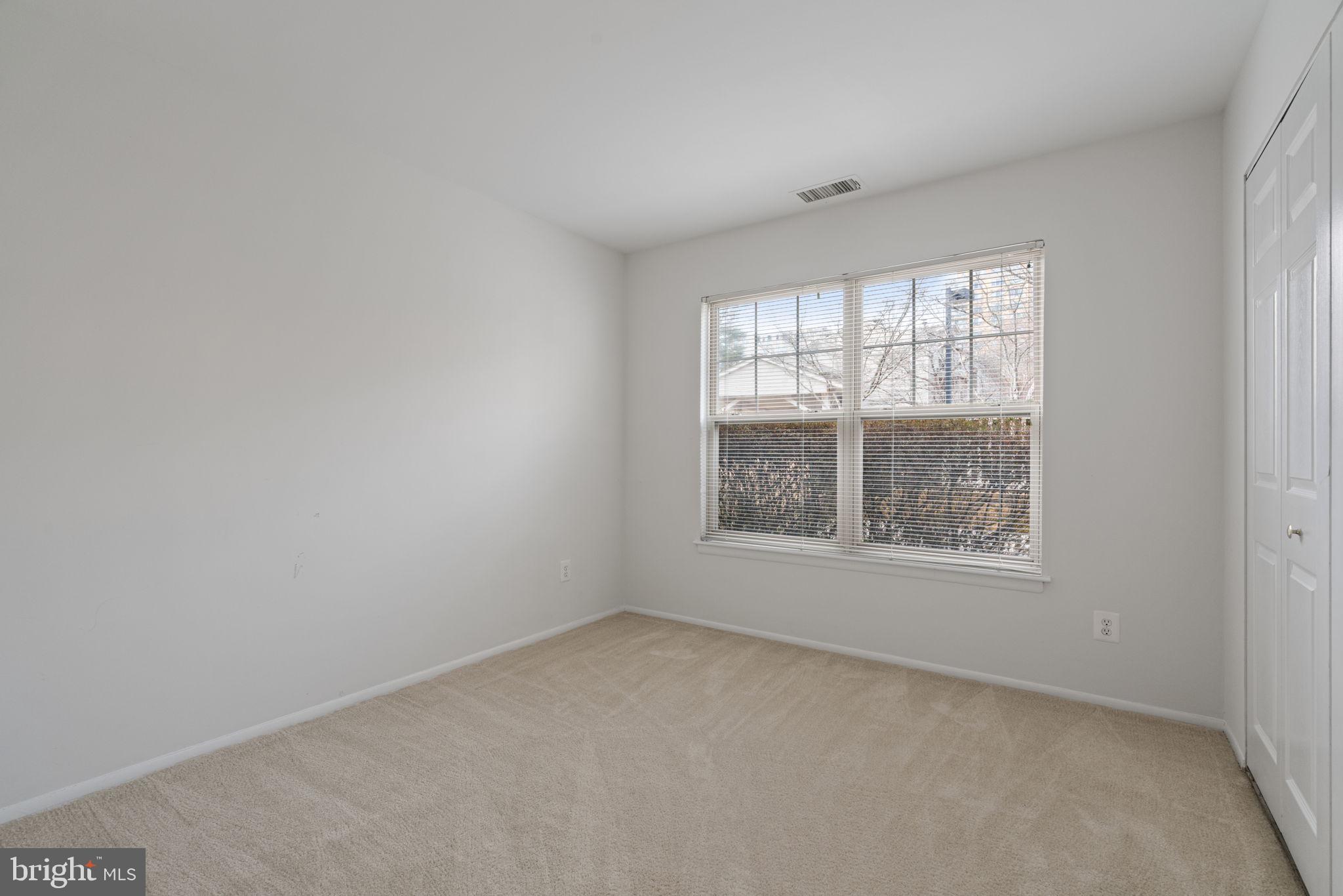 11703 Olde English Drive, Unit B Reston, VA 20190 - Photo 17 of 32 an empty room with a window