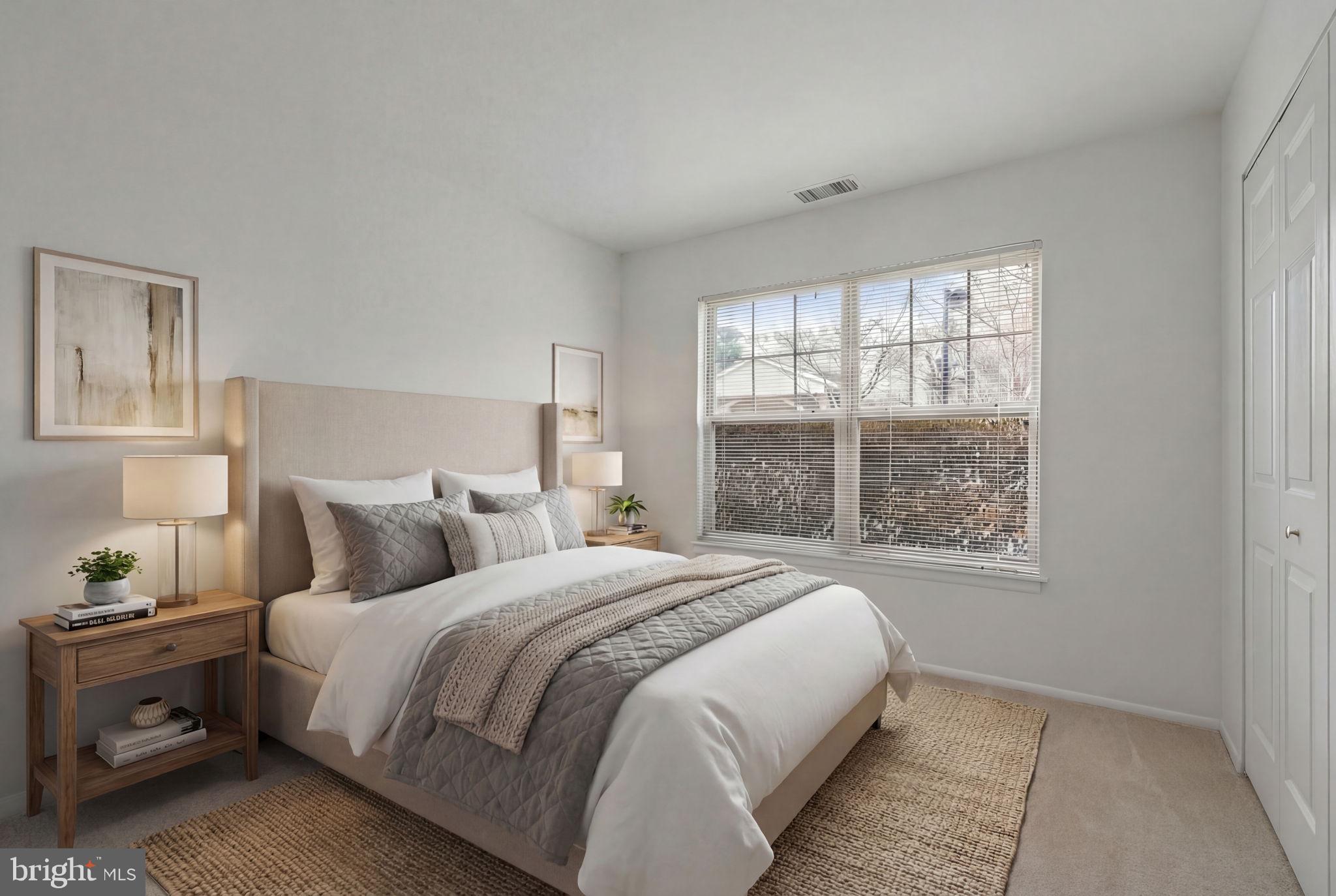 11703 Olde English Drive, Unit B Reston, VA 20190 - Photo 18 of 32 a bedroom with a bed and a window