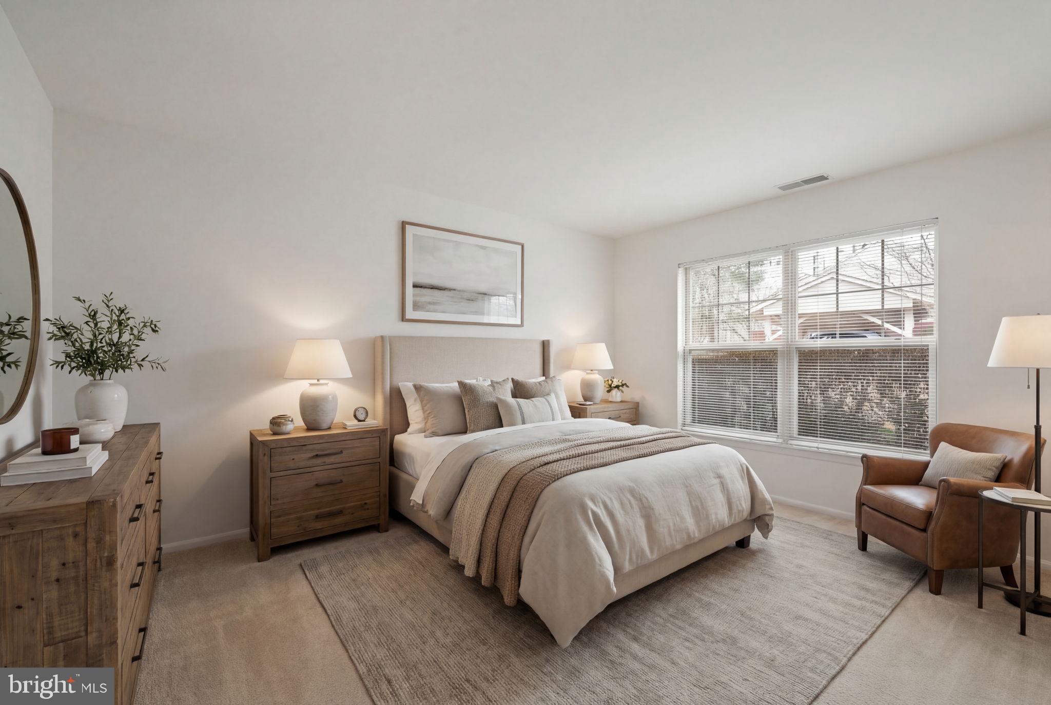 11703 Olde English Drive, Unit B Reston, VA 20190 - Photo 21 of 32 a bedroom with a bed couch and a window