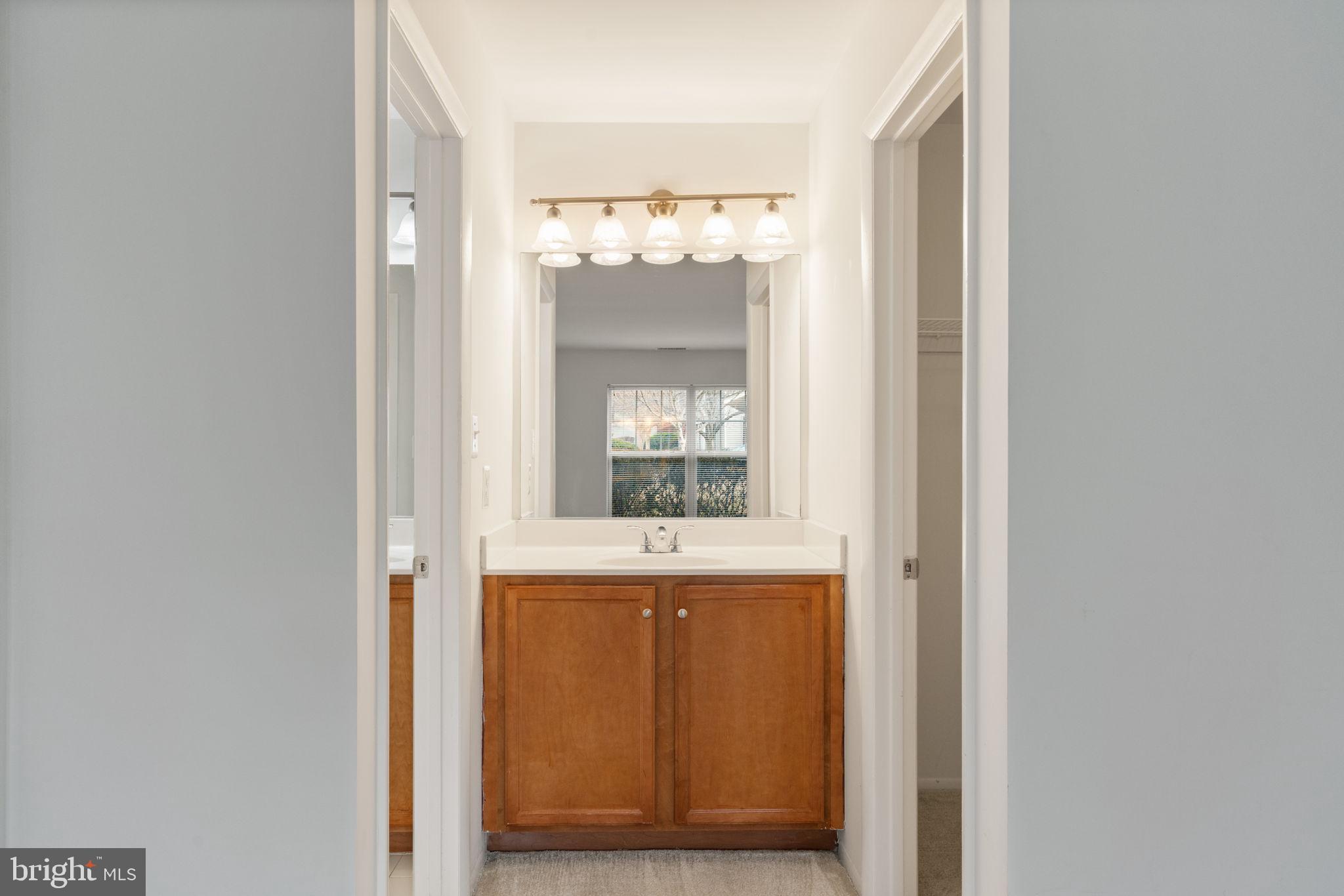 11703 Olde English Drive, Unit B Reston, VA 20190 - Photo 23 of 32 a view of kitchen with granite countertop cabinets and window