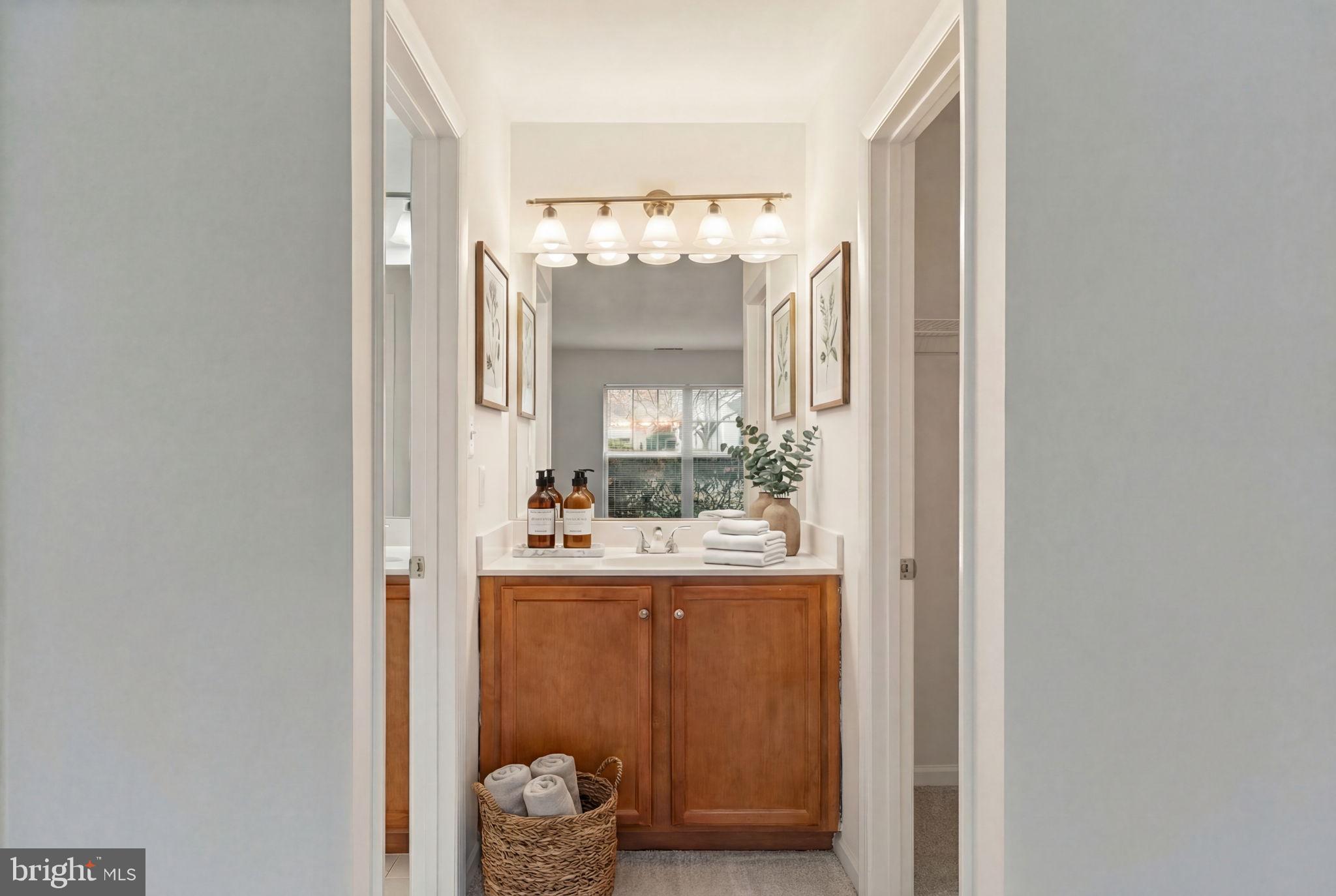 11703 Olde English Drive, Unit B Reston, VA 20190 - Photo 24 of 32 a view of bathroom with mirror and window