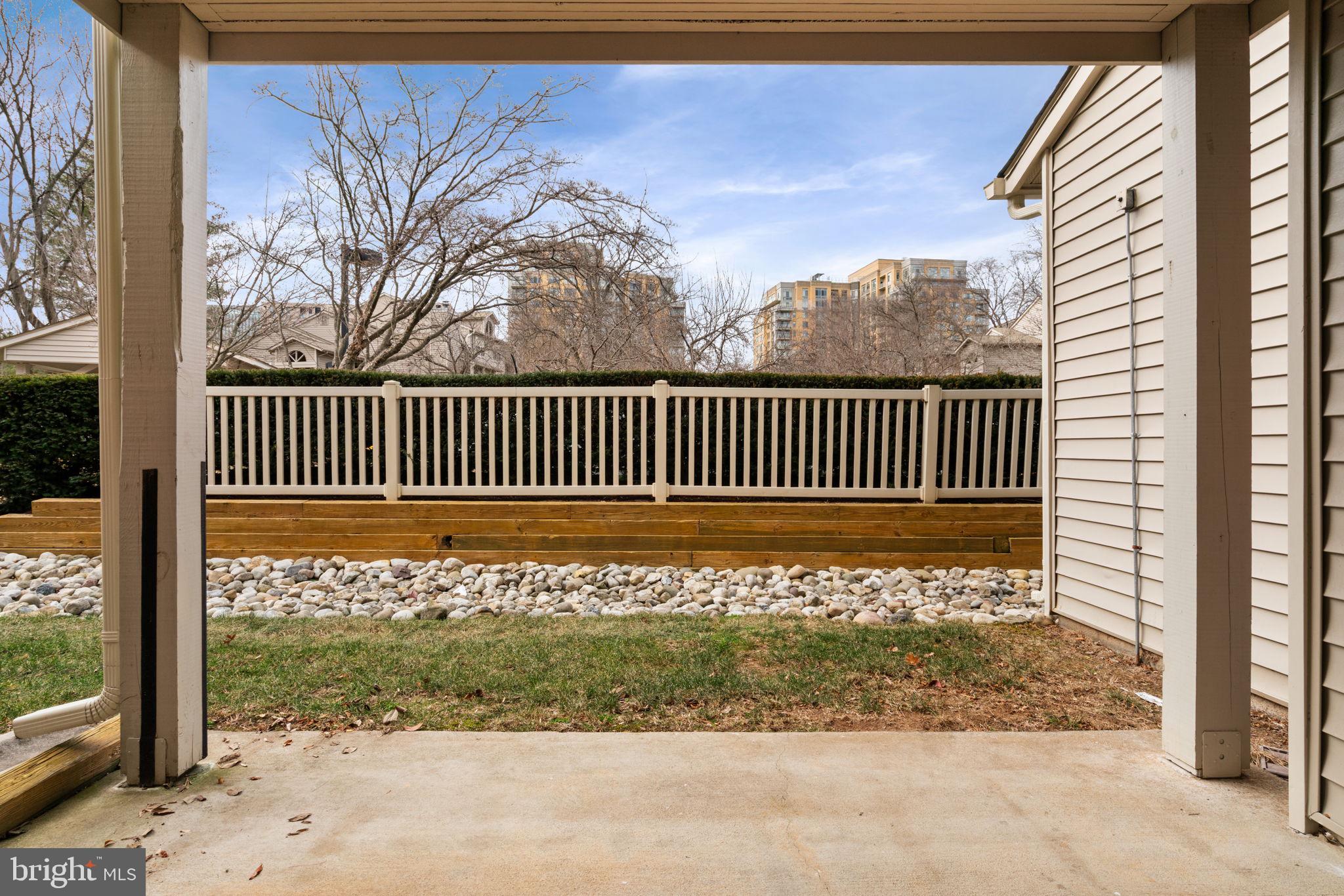 11703 Olde English Drive, Unit B Reston, VA 20190 - Photo 29 of 32 a view of a porch with a door and chair