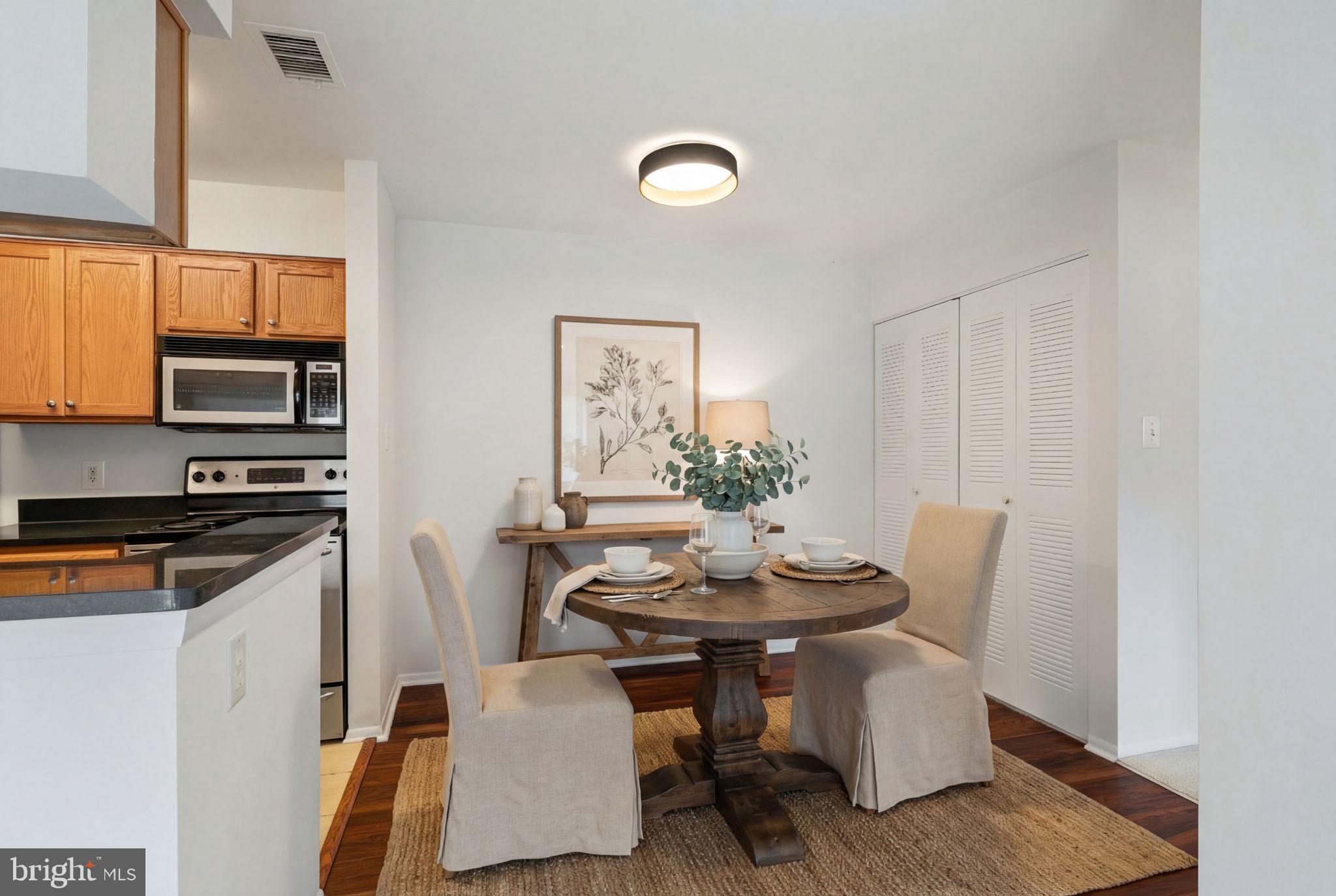 11703 Olde English Drive, Unit B Reston, VA 20190 - Photo 10 of 32 a view of a dining room with furniture