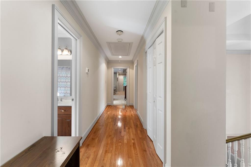 24 Commerce Row Northeast Cartersville, GA 30121 - Photo 25 of 37 a view of a hallway with wooden floor and staircase