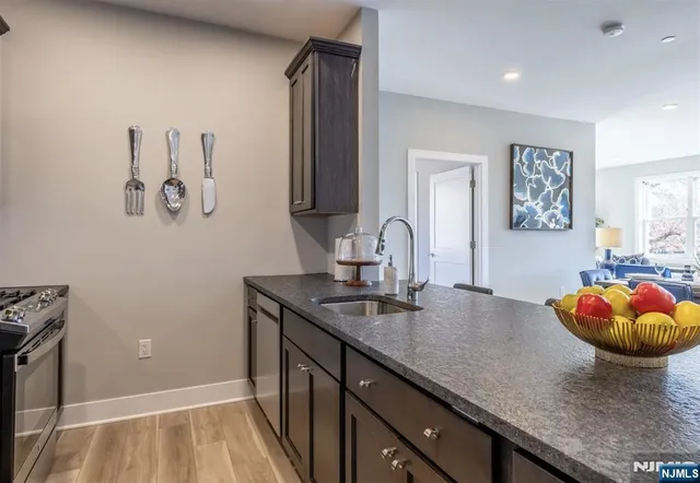 a kitchen with a sink and cabinets