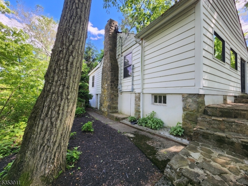 7 Raccoon Island Road Lake Hopatcong, NJ 07849 - Photo 20 of 24 a front view of a house with a yard