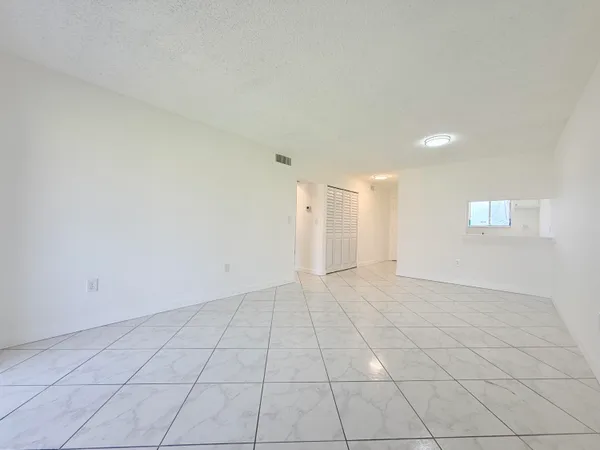 a view of an empty room and window