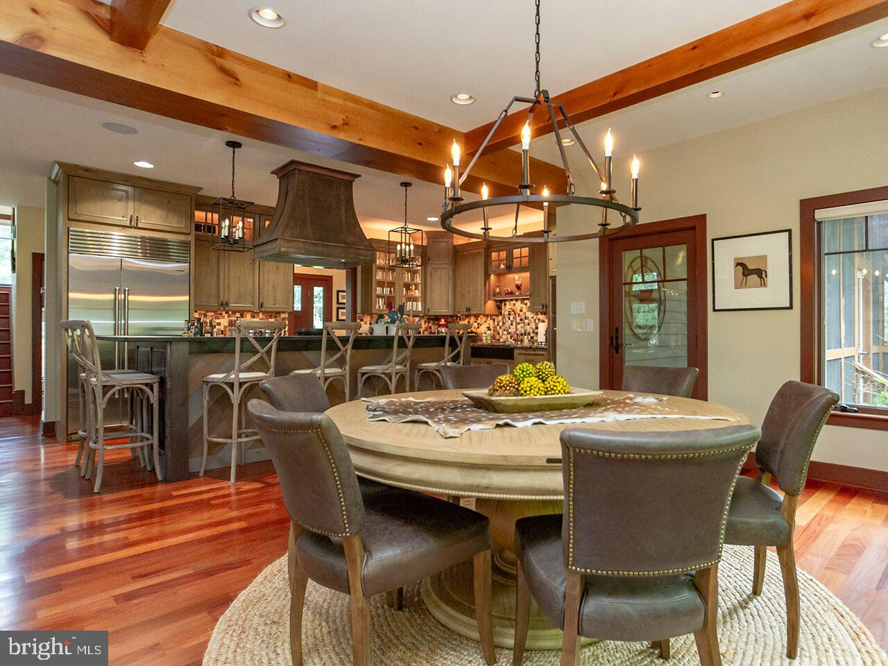 930 Corbett Road Monkton, MD 21111 - Photo 14 of 102 a view of a dining room with furniture and wooden floor