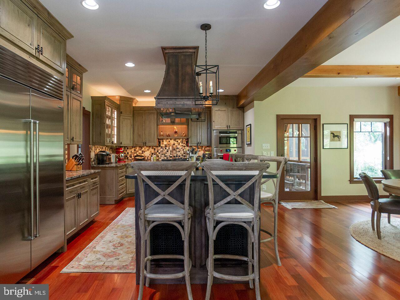 930 Corbett Road Monkton, MD 21111 - Photo 24 of 102 a view of a dining room with furniture and wooden floor