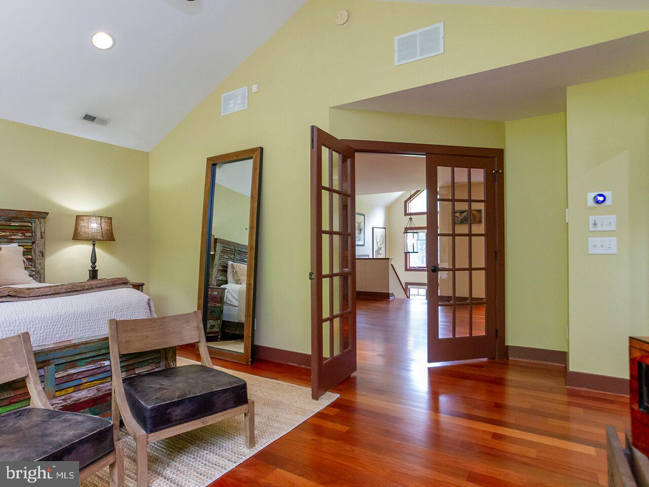 930 Corbett Road Monkton, MD 21111 - Photo 36 of 102 a bedroom with a bed and wooden floor