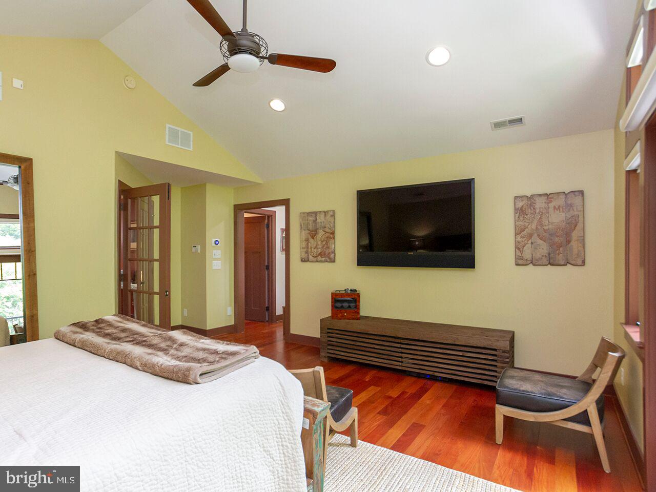 930 Corbett Road Monkton, MD 21111 - Photo 38 of 102 a bedroom with a bed and a flat screen tv