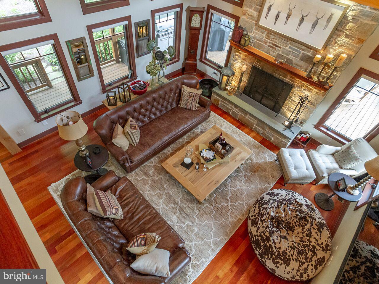 930 Corbett Road Monkton, MD 21111 - Photo 44 of 102 a living room with furniture and a floor to ceiling window