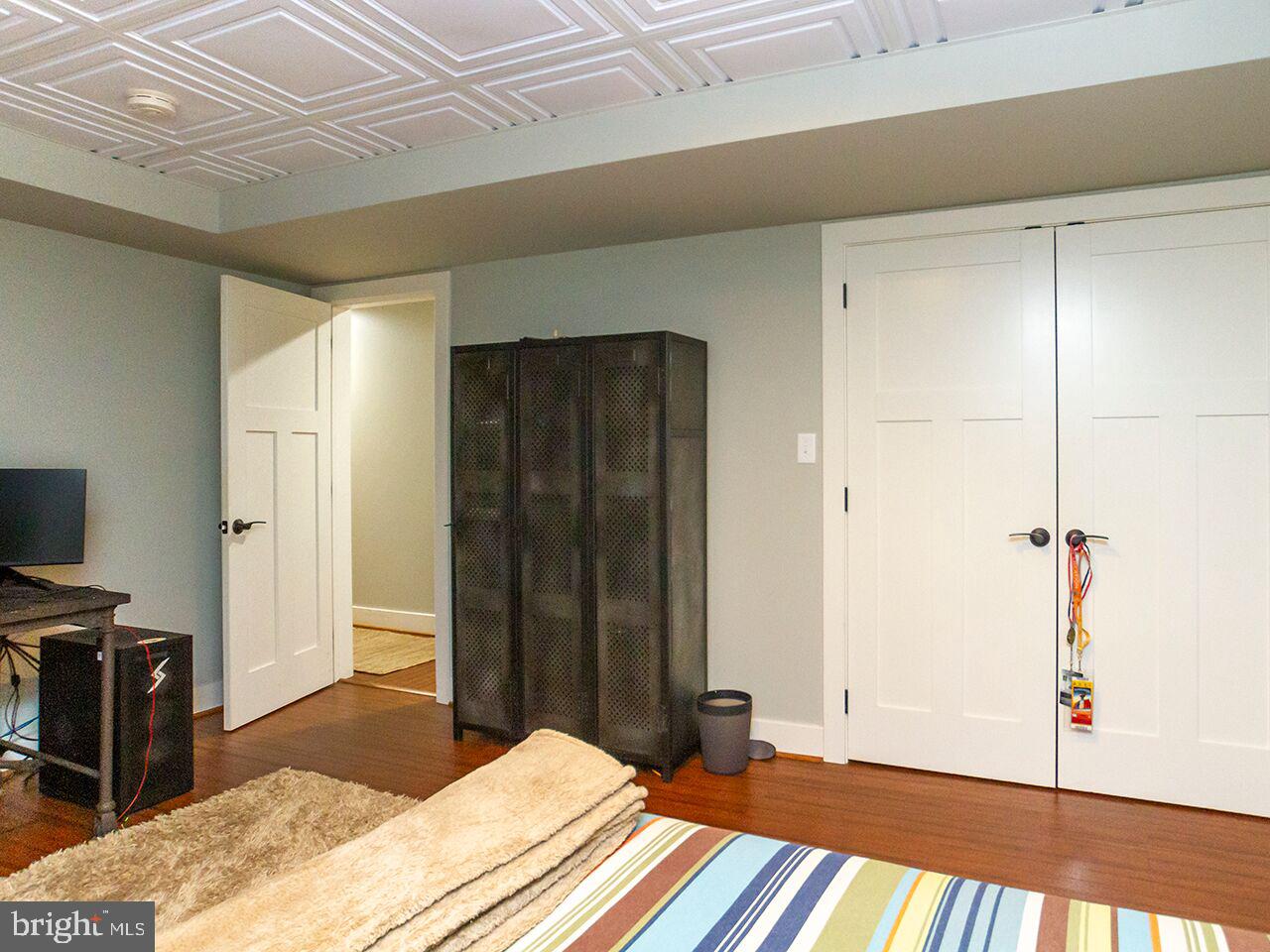930 Corbett Road Monkton, MD 21111 - Photo 49 of 102 a bedroom with a bed and wooden floor