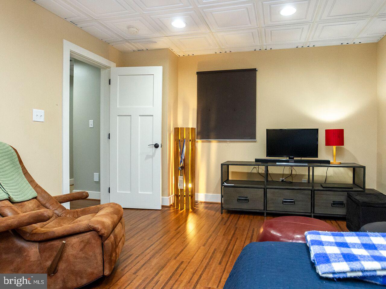 930 Corbett Road Monkton, MD 21111 - Photo 50 of 102 a living room with furniture and a flat screen tv