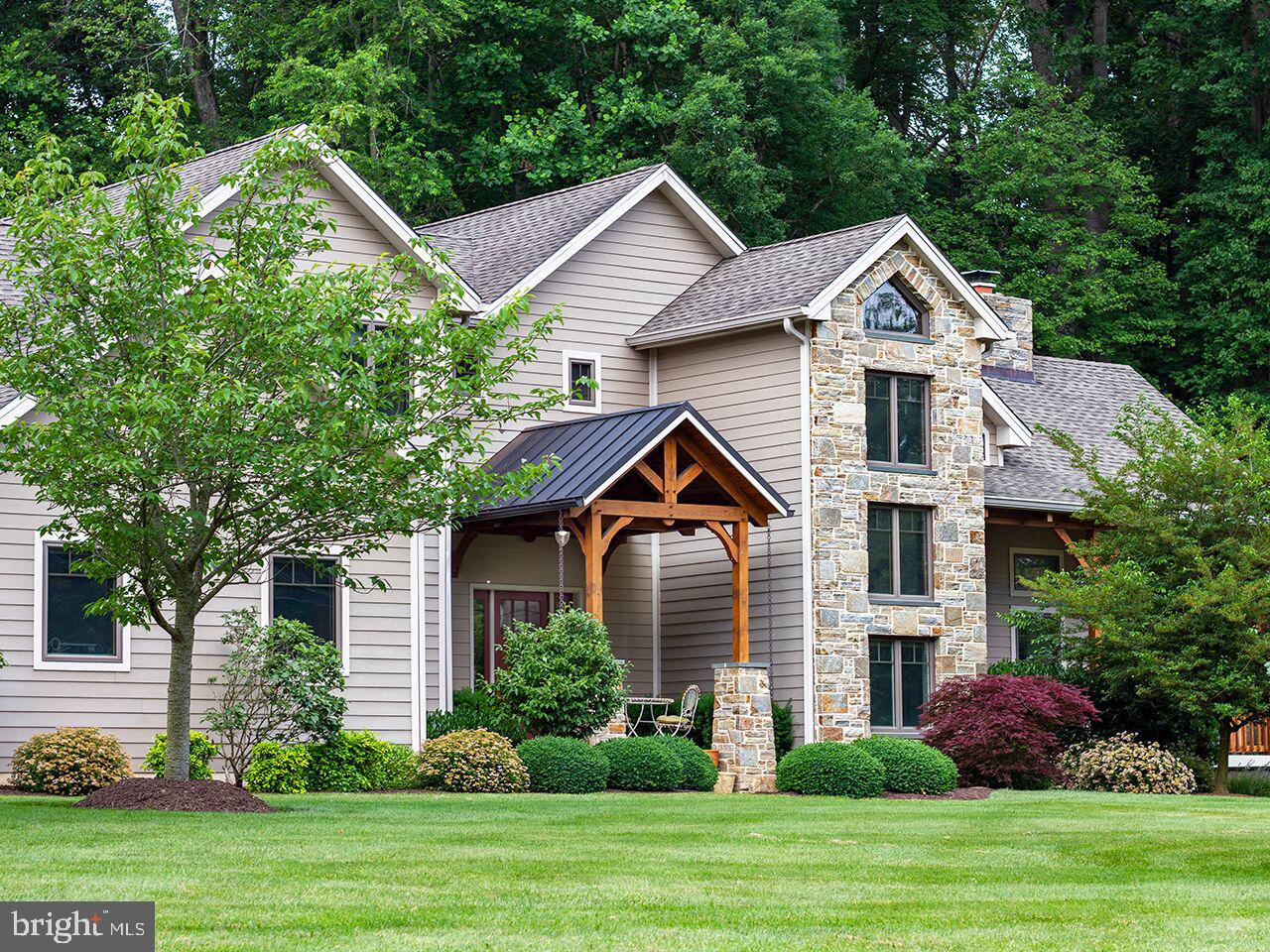 930 Corbett Road Monkton, MD 21111 - Photo 92 of 102 a front view of a house with a yard and trees