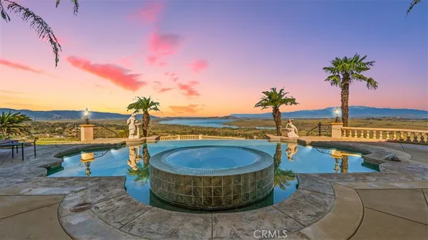 a view of a swimming pool with a terrace