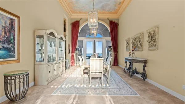 a bedroom with furniture and a chandelier