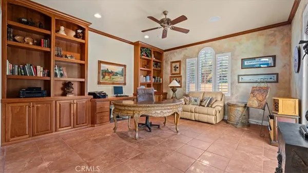 a view of a dining room with furniture and a chandelier