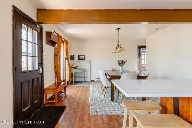 a view of a living room and a wooden floor