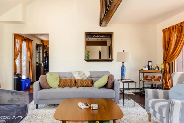 a living room with furniture and a couch