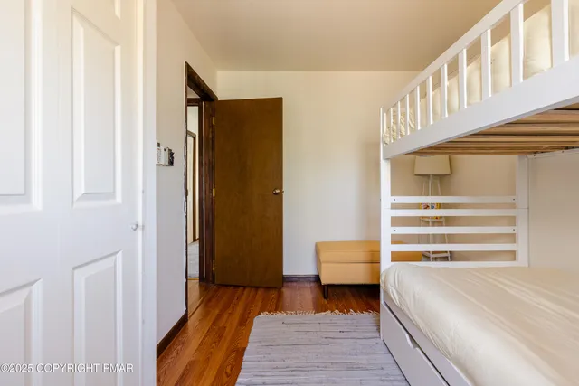 a bedroom with a bed and a table