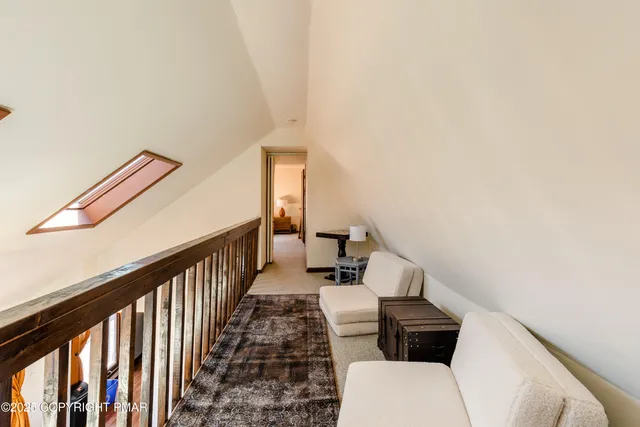 a living room with furniture and a rug
