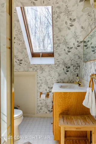 a bathroom with a toilet and a bathtub