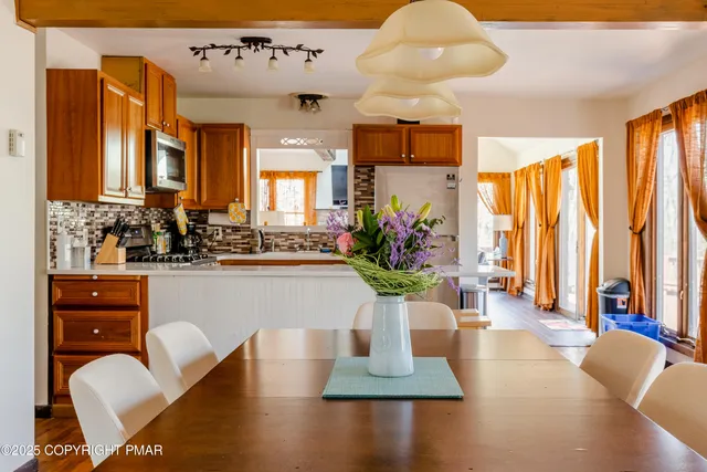 a view of living room with furniture and potted plant