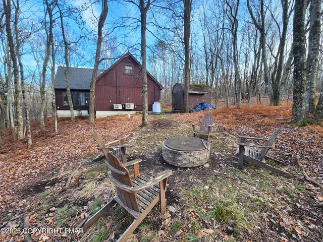 a backyard of house with outdoor seating