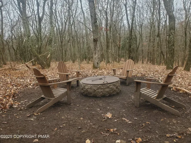 a view of a backyard with sitting area