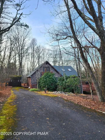 a view of a street with a building in the background