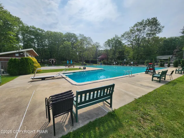 a view of a backyard with sitting area