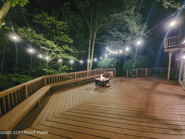 a view of balcony with deck and outdoor seating