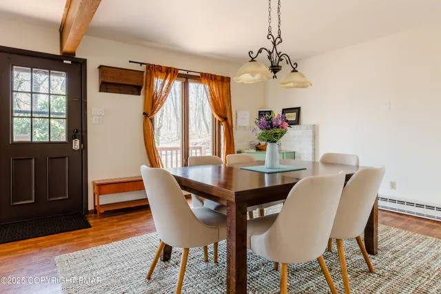 a view of a dining room with furniture window and outside view