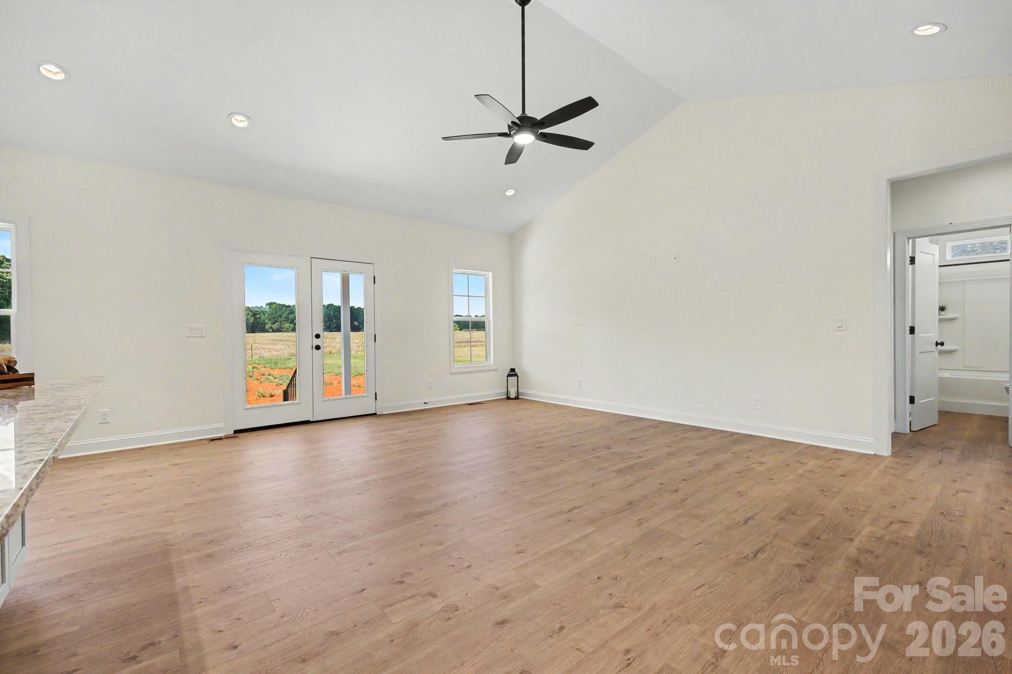 190 Goodnight Road Salisbury, NC 28147 - Photo 7 of 35 a view of an empty room with a window and wooden floor