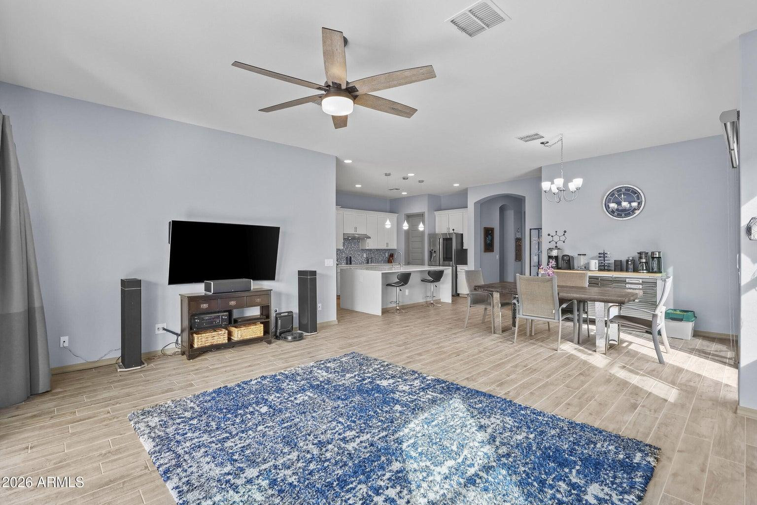 4451 East Bernice Street Gilbert, AZ 85295 - Photo 11 of 32 a living room with furniture and a flat screen tv